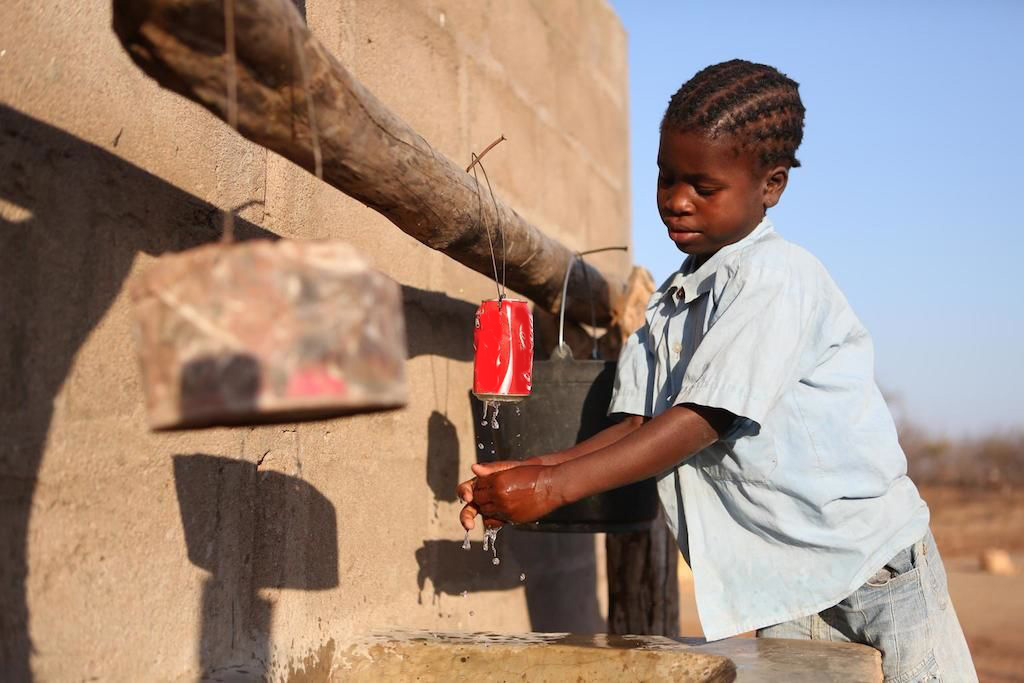 Aranna, 9, used to walk an hour a day to fetch water in Tete Province, Mozambique. A UNICEF-built borehole has given her more time for school. “I always want to learn more,” she says.
