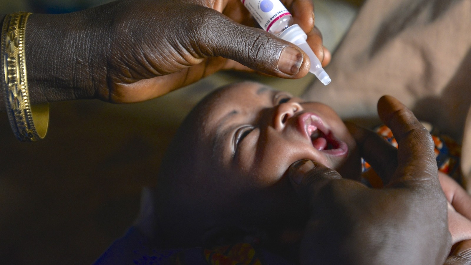 World Polio Day 2015. A infant in Nigeria is immunized against polio during a UNICEF-supported vaccination drive in March,2015.