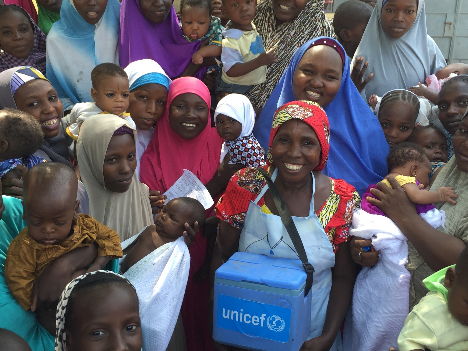polio vaccinator Aisha Bulama in Maiduguri Metropolitan Council, Borno State, Nigeria. As a polio vaccinator, Aisha is a key member of one of thousands of UNICEF-supported polio vaccination teams who began immunizing children against polio