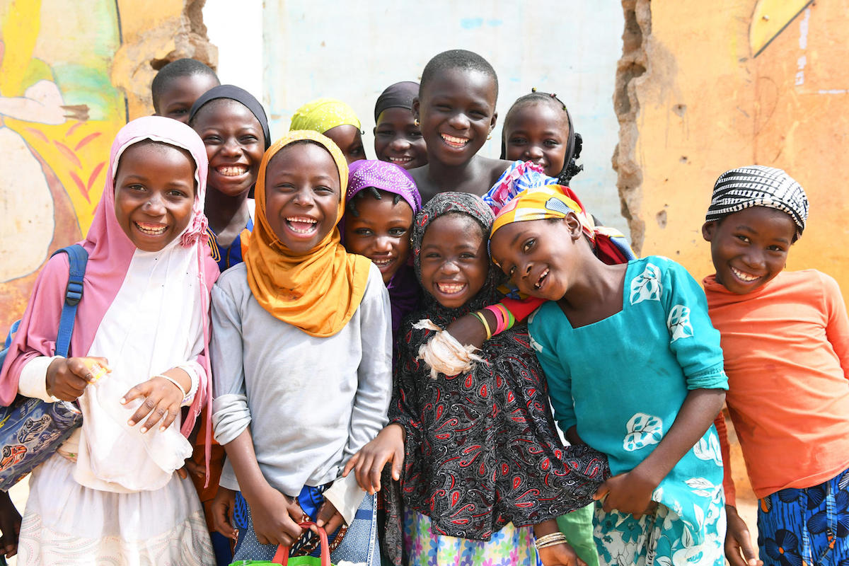 Friends smile in Korohogo, in southwest Côte d’Ivoire.