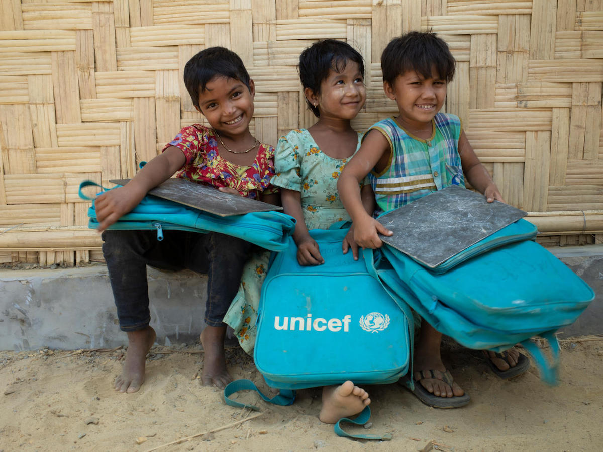 Rohingya girls sit outside a UNICEF-supported Learning Center in Balukhali camp for Rohingya refugees in Cox's Bazar District, Bangladesh on 4 March 2018.