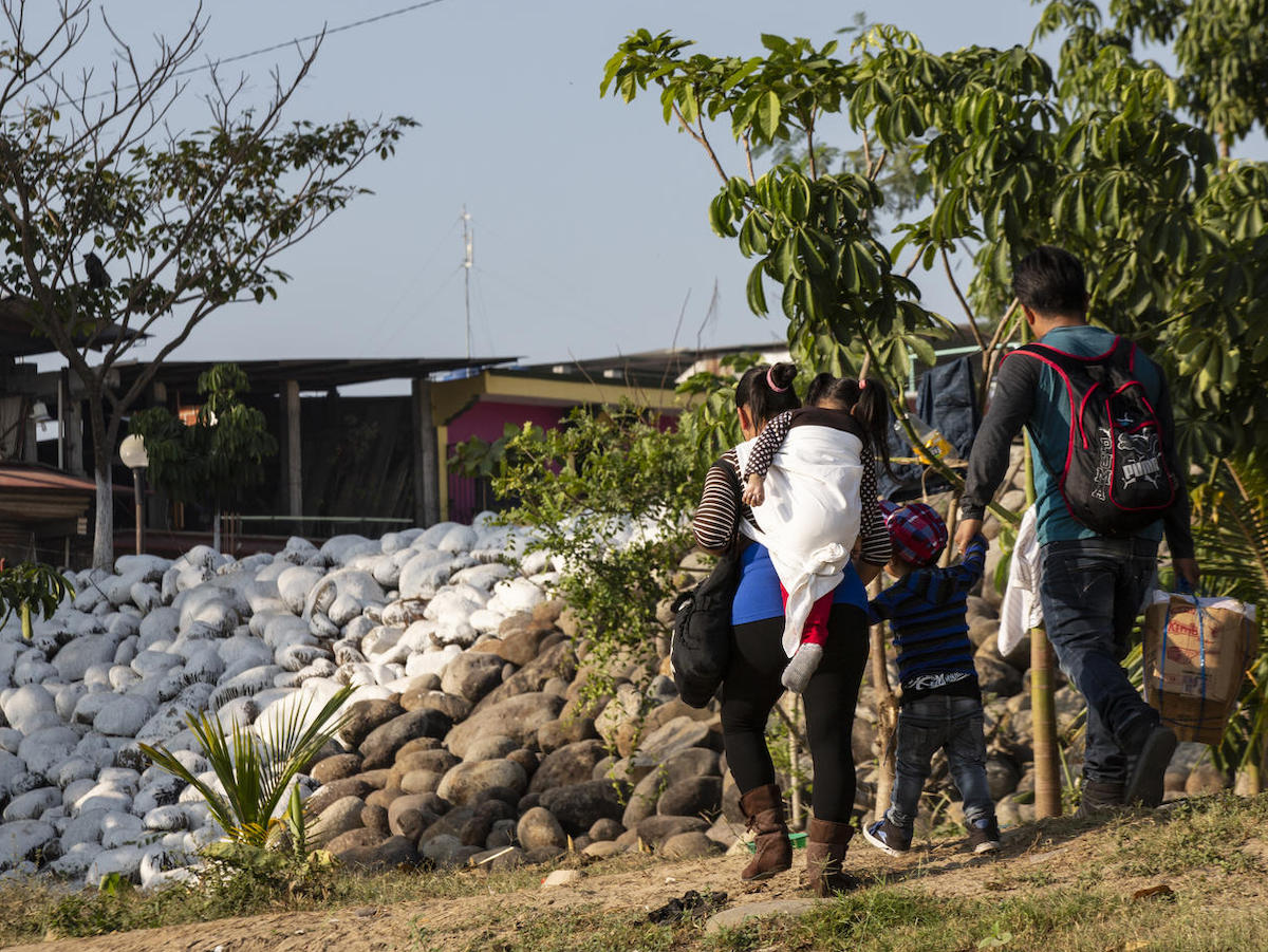 A family crosses the Suchiate River at the Mexico-Guatemala border in Ciudad Hidalgo, Mexico on January 31, 2019.