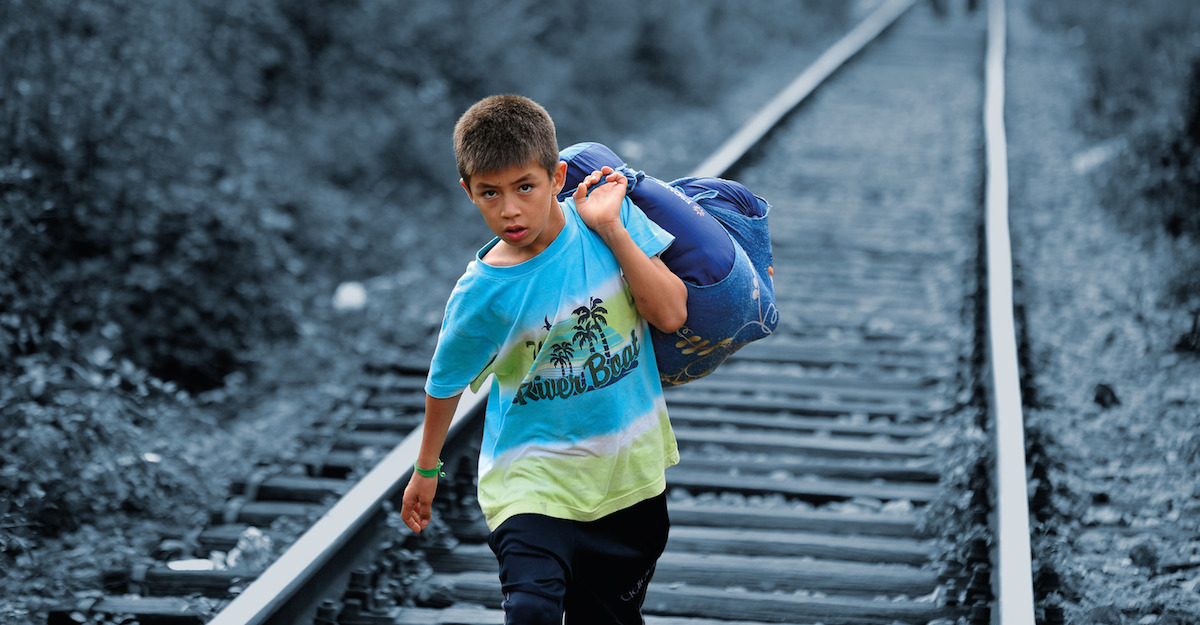 A Syrian refugee crossing into Serbia.
