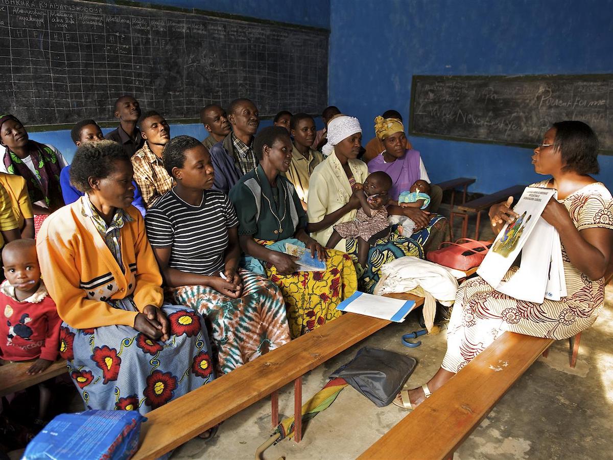 A UNICEF-supported female facilitator leads a Circle of Dialogue to discuss important social issues like health, hygiene, sanitation and HIV prevention at a church in the village of Rwaza in Musanze district, northern Rwanda. 
