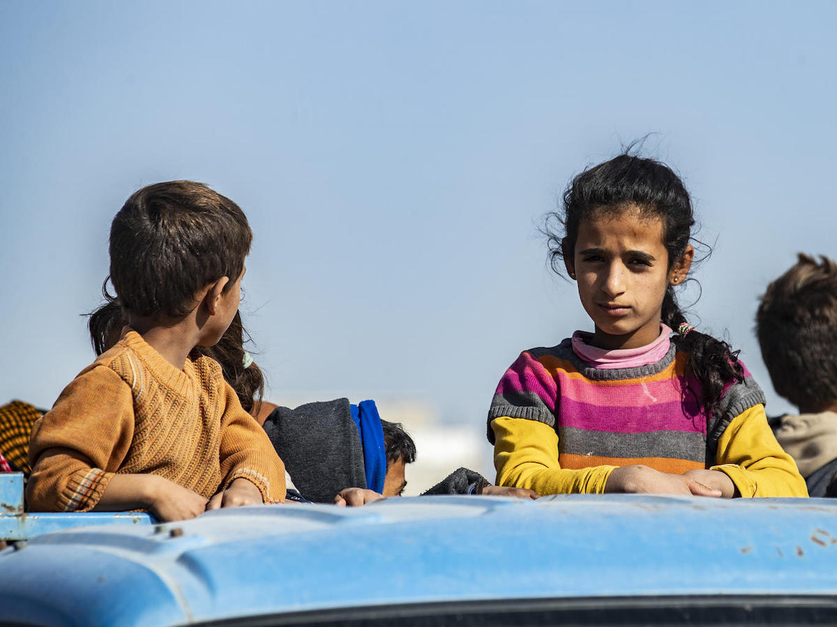 In October 2019, families fleeing escalating violence in northeast Syria continue to arrive in Tal Tamer, carrying only the bare essentials. 