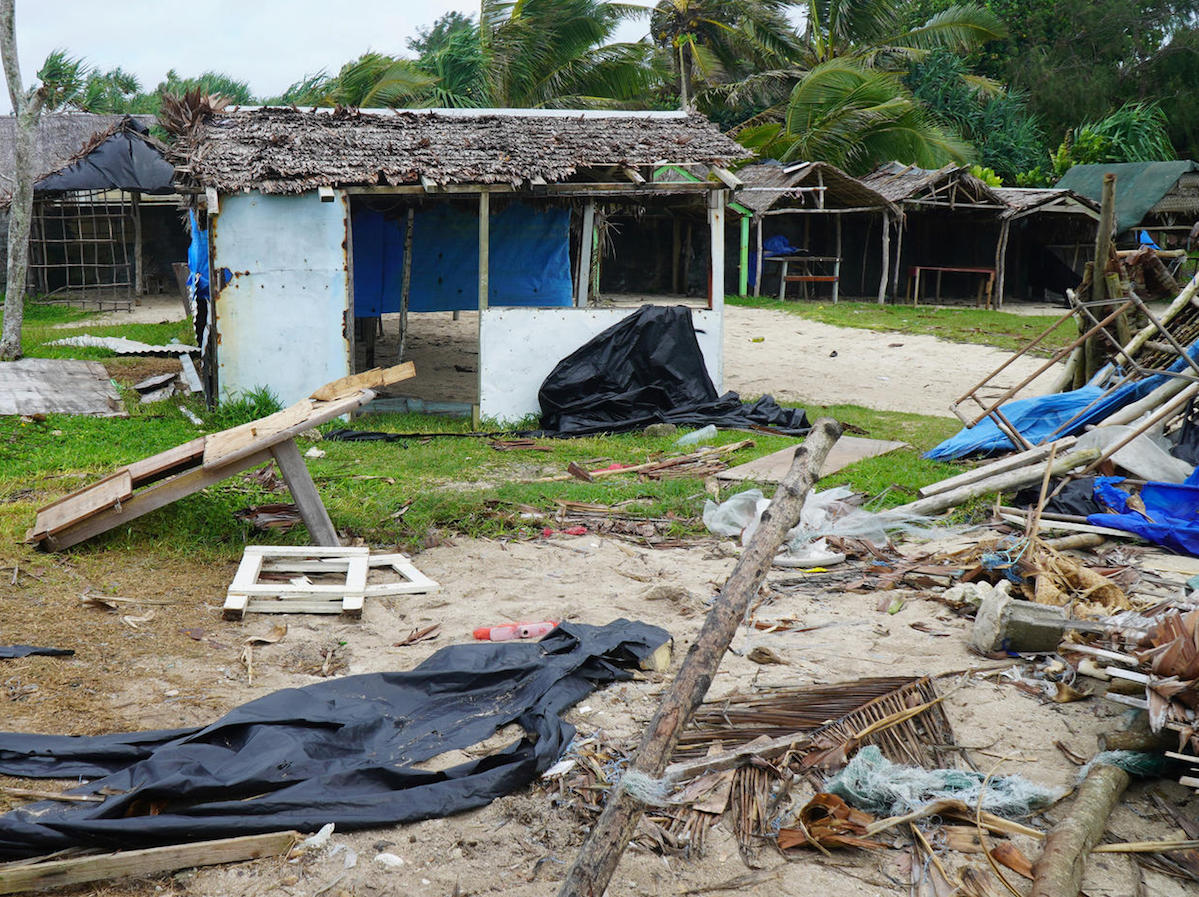 Badly damaged buildings are pictured near Vanuatu's capital of Port Vila on April 7, 2020, after Tropical Cyclone Harold swept past and hit islands to the north. 