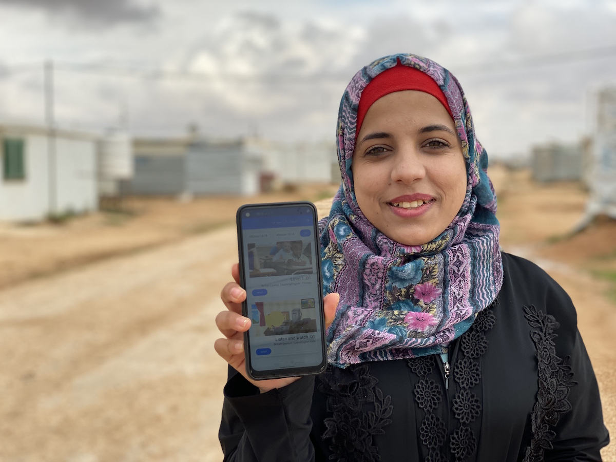 At a youth center in Azraq refugee camp in Jordan, home to more than 37,000 Syrian refugees, 19-year-old Amani accesses remote learning resources via the Learning Passport mobile app on a smart phone she received from UNICEF. 