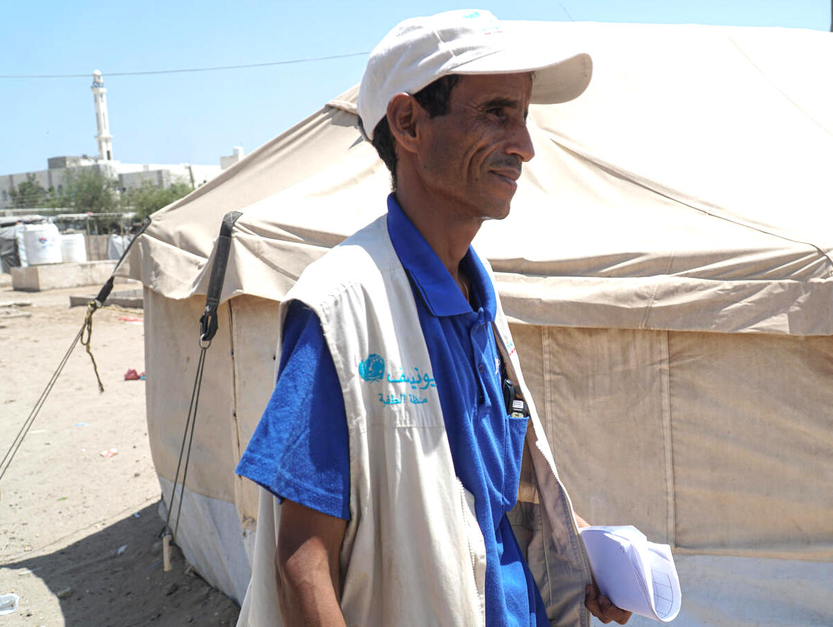   Yahya Ahmed Ganem Al Sofy works as a UNICEF community outreach worker sharing  hygiene information to prevent the spread of COVID-19 in Al Sha'ab IDP (short for internally displaced persons) camp in Aden, Yemen. 