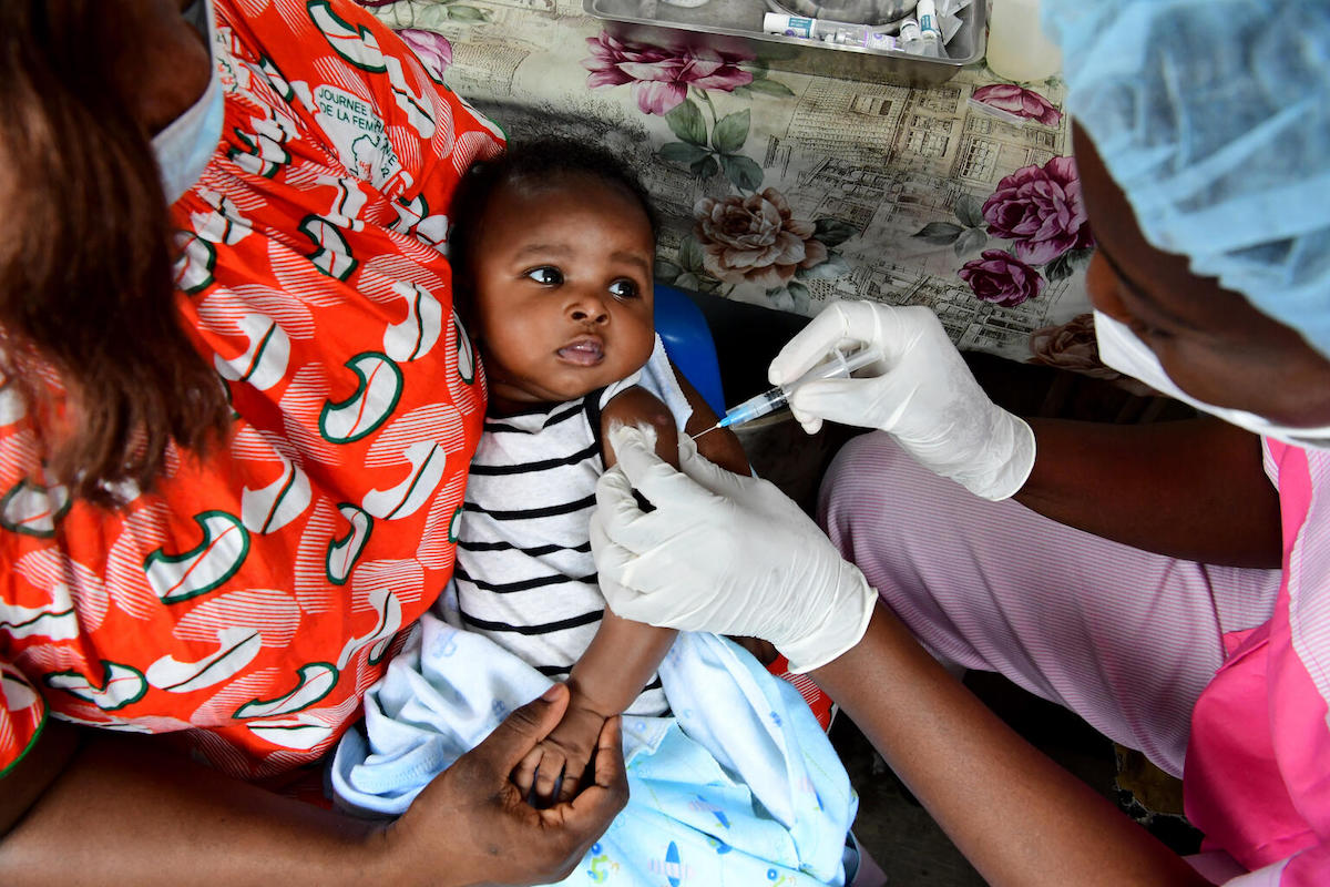 A baby receives a routine vaccination at a UNICEF-supported health center in in Gonzagueville, a suburb of Abidjan, in southern Côte d’Ivoire.