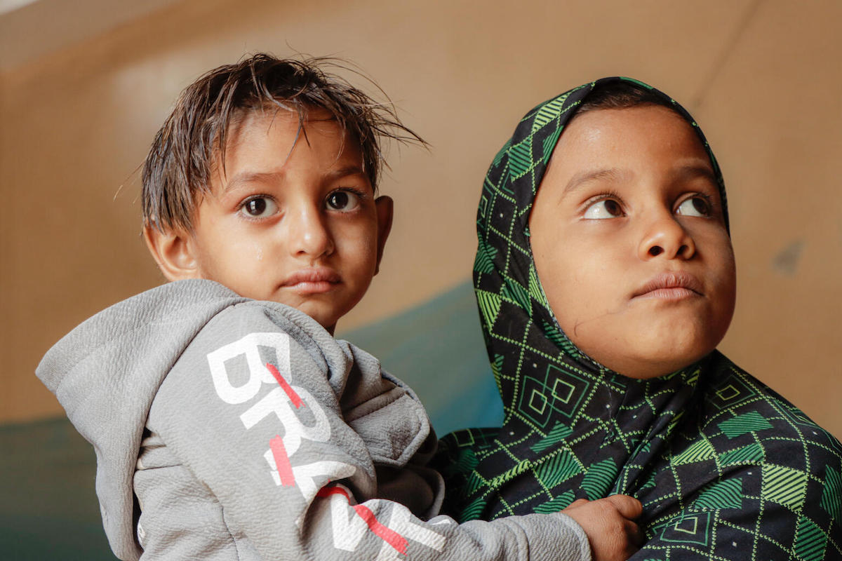 3-year-old Aseel of Al Hudaydah, Yemen, held by his cousin, is recovering slowly after treatment for severe acute malnutrition with UNICEF's help.
