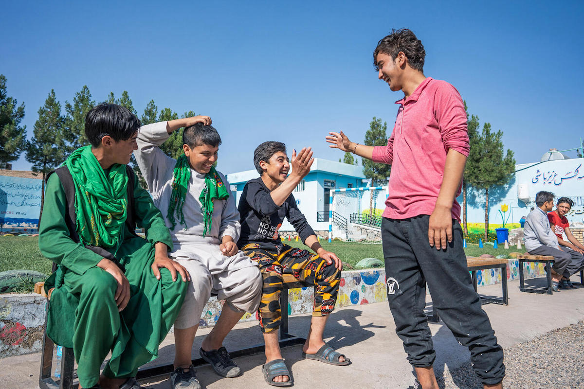 Adolescent boys who are returning migrant workers greet each other at the UNICEF-supported Gazargah Transit Center in Herat, Afghanistan.