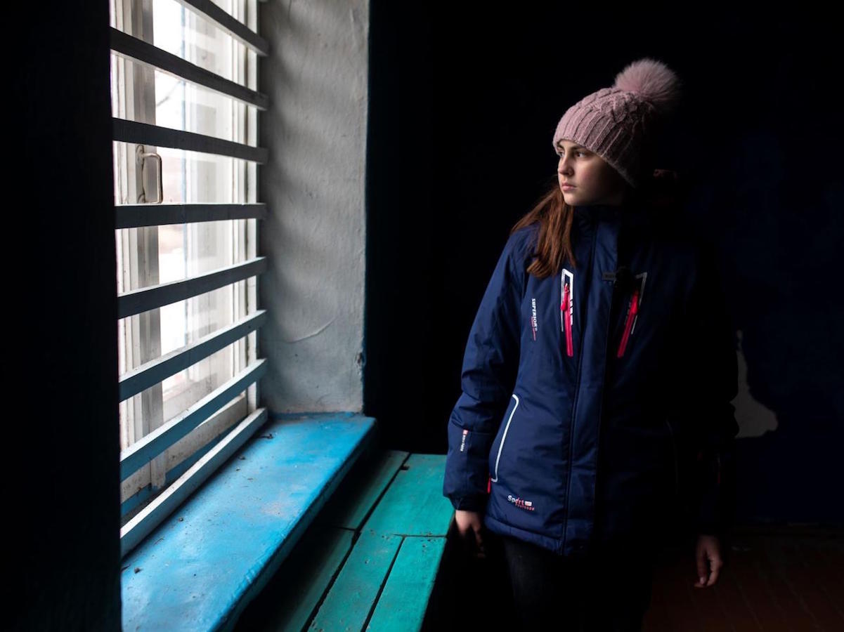 Nastia, 16, in the cellar where she and her family plan to take shelter in eastern Ukraine. 