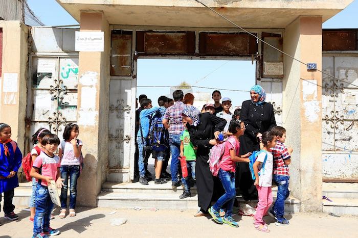 Mothers picking up their children from a school in Homs.