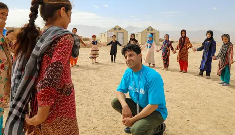 hild Protection Officer Hashmat Latifi works with children at the Ferdousi camp for displaced families in Nahri Shahi district, Balkh, north Afghanistan.