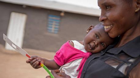 A mother holds her 8-month-old daughter, Mercy, after attending a UNICEF nutrition workshop in Juba, South Sudan.