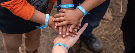 Pilar Escudero, Communication Associate at UNICEF Guatemala plays with Herson (4), Oscar (8) and Edwin (3) in San Cristobal, Alta Verapaz, Guatemala.