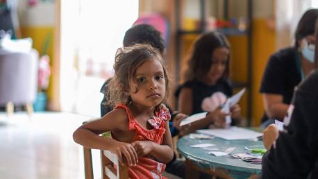 Joselin, 4, from Venezuela, receives help at a UNICEF-supported reception center for migrant families in Iquique, Chile, on April 25, 2022.