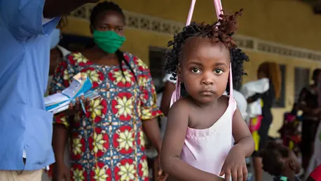 A 9-month-old girl is screened for malnutrition at the UNICEF-supported Kinkole Health Center, Nsele, Kinshasa, DRC. ©UNICEF/UNI357329/Desjardins