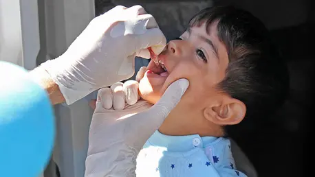 Child being given medicine by dropper