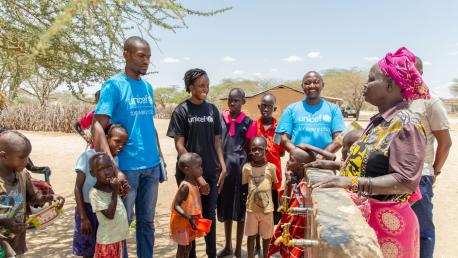 On 9 September 2022 in Sopel, Turkana County, Kenya, Vanessa Nakate (black UNICEF shirt) at a community water point. Here she meets Mary Aspital who manages the water point which serves both the community and their livestock.