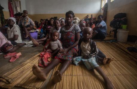 A mother and her two children shelter in a primary school in central Mozambique after they lost their home to Cyclone Freddy.