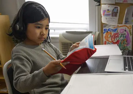 Yolanda, 9, participates in one of her first virtual classes while studying from home in New York City during the COVID-19 pandemic.