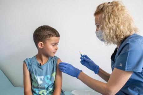 Mykyta, 6, who escaped the war in Ukraine with his family, receives his immunizations at the UNIMED medical center in Krakow, Poland.