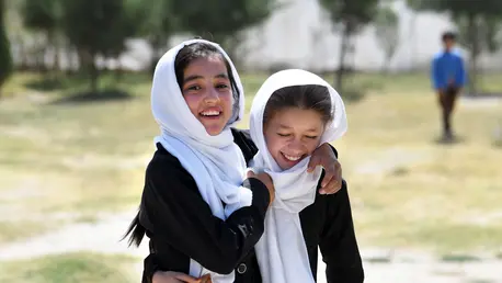 Two girls hugging and smiling