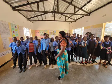 A teacher and her students at the Bimbe School in Chongwe district, Lusaka province, Zambia, where UNICEF and partners support an accelerated learning program to help students catch up.
