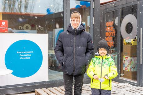 Maxim, 12, and Nazar, 6, stand outside the Siret Blue Dot center at the Romanian border on March 10, 2022, after fleeing Ukraine with their mothers. 
