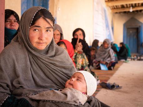 On May 17, 2022, in Kiti District, Daikundi Province, Afghanistan, people wait to receive their cash-based assistance provided by UNICEF to families with pregnant or breastfeeding women.