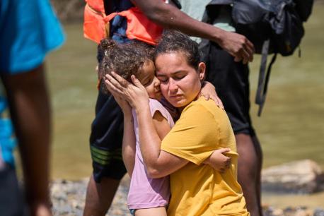 In Lajas Blancas, Darién, Panama in February 2023, a mother and child are reunited after becoming separated in the Darién jungle, one of the world's most dangerous migrant routes.