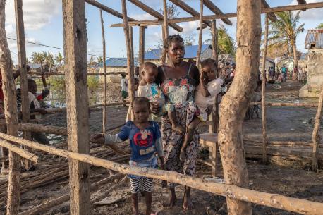 In the Icidua neighborhood of Quelimane, Zambezia, Mozambique, Celia Lacedo and her three children—5-year-old Santos, 2-year-old Calimo and 3-year-old Susan Jonito—stand in the remnants of their home destroyed Cyclone Freddy.
