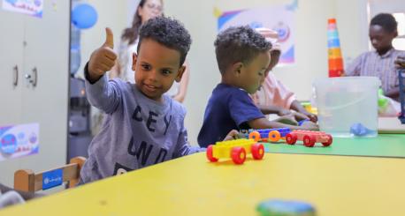 Young children, refugees from Sudan, play with toys inside a UNICEF Child-Friendly Space near Aswan, Egypt, a destination for hundreds of thousands of Sudanese fleeing conflict.