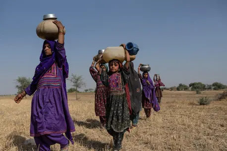 Young girls fetching water near a contaminated pond in Allah Abad, Jampur, South Punjab, Pakistan.