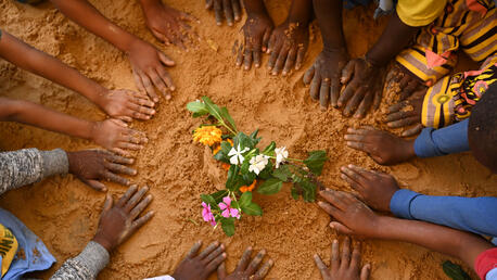 Children planting flowers at the playground of the kindergarten JEP in N’Djamena, the capital of Chad. 