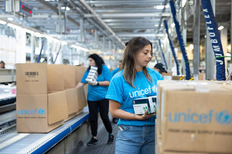At the UNICEF Global Supply and Logistics Hub in Copenhagen, staff pack medical, nutrition and shelter supplies for delivery to children and families affected by devastating floods in northeastern Libya. 