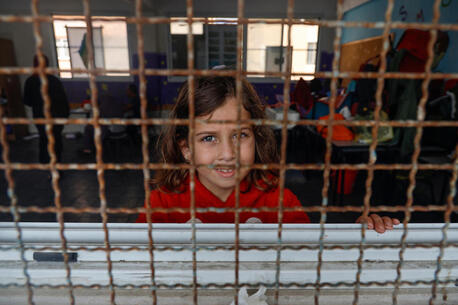 Emilia, 6, stands in a UNRWA (United Nations Relief and Works Agency for Palestine Refugees in the Near East) school being used as a shelter in Gaza City. 