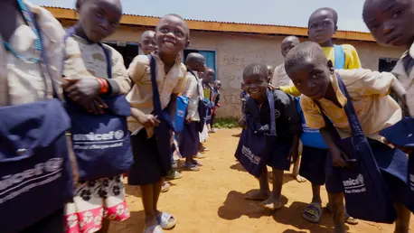 Students attending UNICEF-supported EP Ngbago school in Rhoe, Ituri Province, eastern Democratic Republic of the Congo, include hundreds of girls and boys staying at the nearby displacement camp.