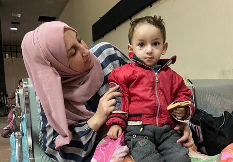 On Jan. 10, 2024, Mageda and her 1-year-old son, Sahad, wait at the Rafah Crossing, seeking authorization to exit the Gaza Strip for medical treatment.