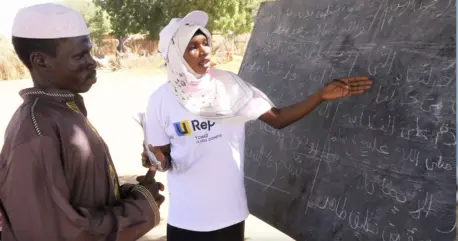 Sudanese refugee Mouwahib Mahamat Adam, 23, teaches literacy classes to local community members in Chad.