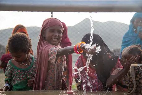 Children collect clean and safe water from a new water station in the small village of Gelhanty in Agig locality, Red Sea state, Sudan.