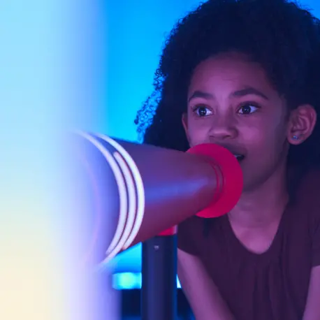 A girl attends Heart Strings, a multi-sensory exhibit that teaches visitors about the impact of UNICEF's work for children.