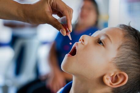 On 31 March 2023, a nurse administers the oral polio vaccine (OPV) vaccine to Samuel, 4, at the Early Childhood Education Centre Rocilda Germano Arruda in Baturité, Ceará state, Brazil.