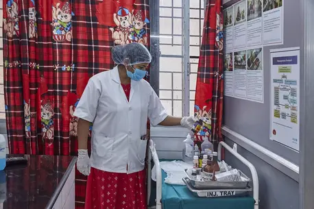 A health care worker follows compliance for labeling medicines at District Combined Hospital in Lodhi, Sonebhadra, Uttar Pradesh, India.