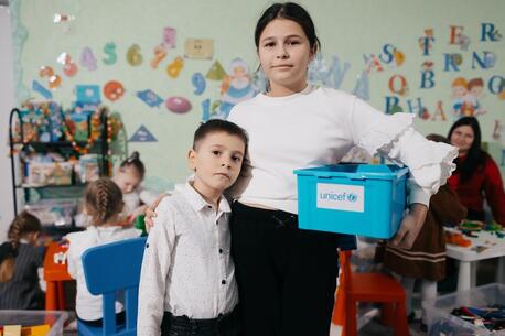 Siblings Eva, 10, and Misha, 6, refugees from Odesa, Ukraine, attend a UNICEF play and learning hub in Balti, Moldova.