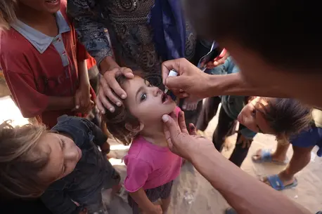 Children receive polio vaccines at a health clinic in Khan Younis, southern Gaza Strip, in September 2024.