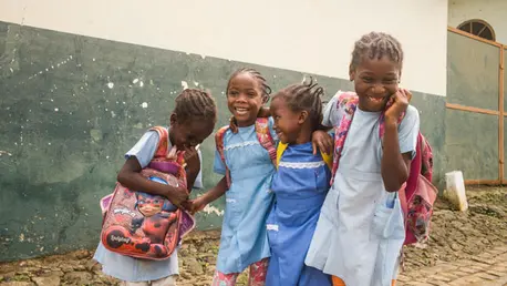 On 8 December 2020 in Sao Tome, Sao Tomé e Principe, a group of schoolgirls laugh on their way to school. ©UNICEF/UN0418198/Tremeau
