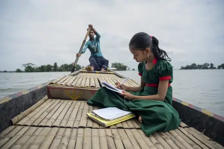 Flooding interrupted schooling for Tawhida, 10, of Manikpur, Shantiganj, Bangladesh, who attends a UNICEF-supported learning center, traveling to and from the school by boat.