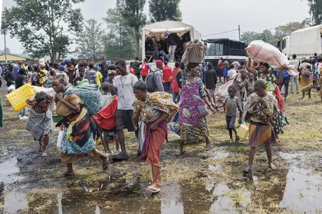 Congolese refugees fleeing ongoing clashes in eastern Democratic Republic of Congo carry their belongings as they arrive at the Rugerero transit camp in Gisenyi on Jan. 28, 2025.